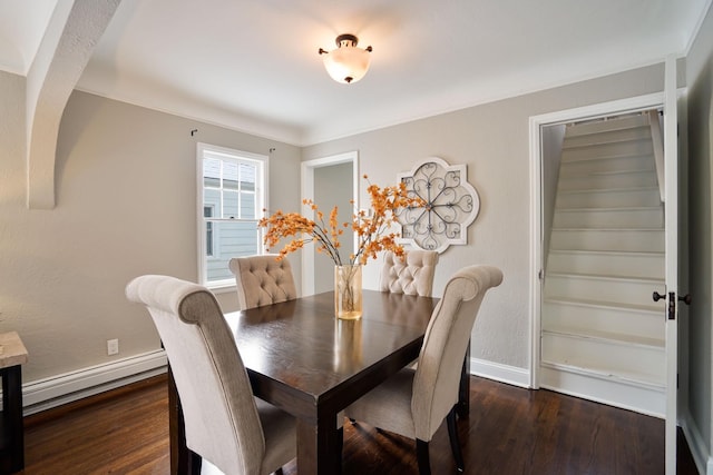 dining area featuring a baseboard radiator and dark hardwood / wood-style floors