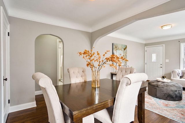 dining space with dark hardwood / wood-style floors