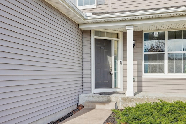 property entrance with covered porch