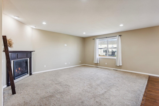 unfurnished living room with hardwood / wood-style floors