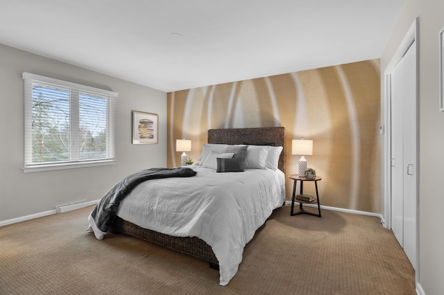 bedroom featuring baseboards and carpet