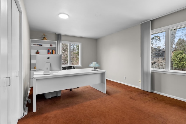 carpeted office space with baseboards