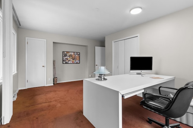 carpeted office space with baseboards