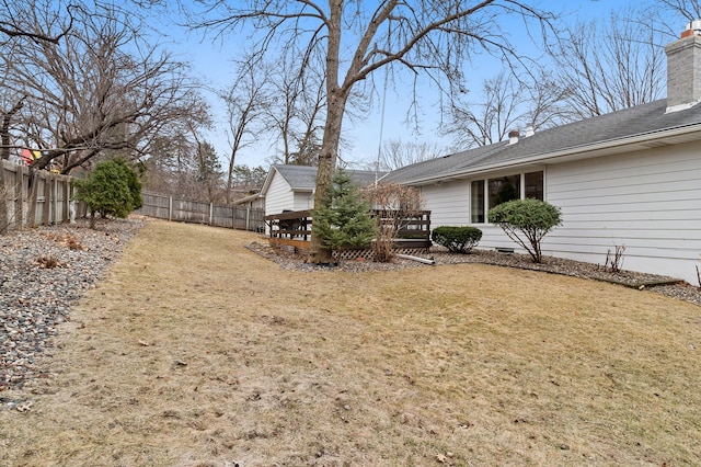 view of yard featuring a fenced backyard and a deck
