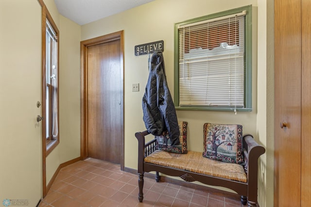 foyer featuring tile patterned flooring