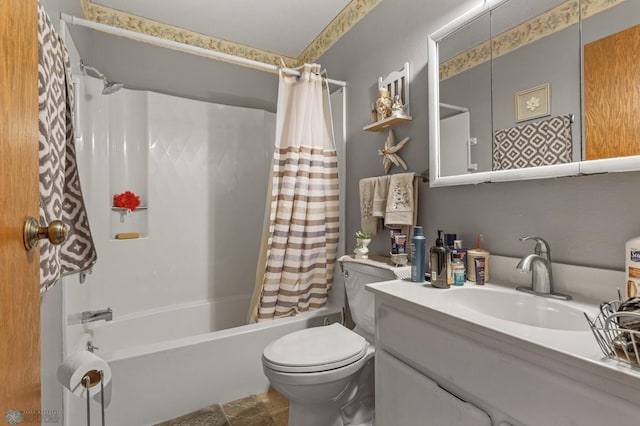 full bathroom featuring shower / tub combo with curtain, vanity, and toilet