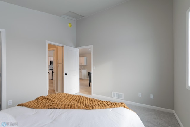 bedroom with light colored carpet