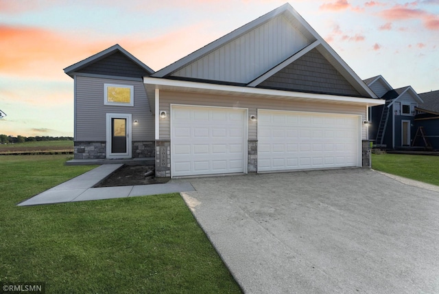 craftsman inspired home featuring a yard and a garage