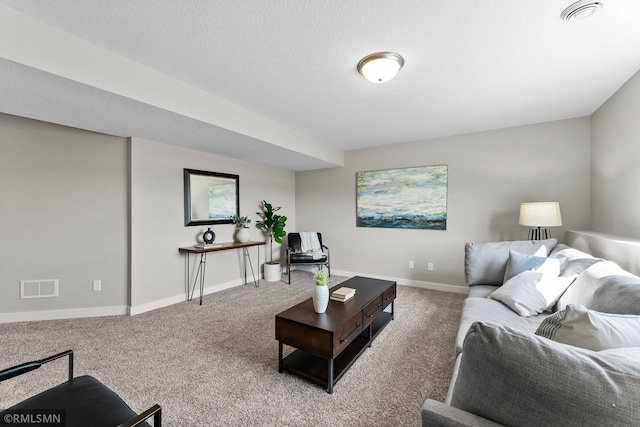 living room with a textured ceiling and carpet flooring