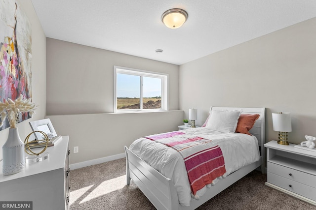 bedroom featuring dark carpet