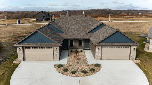 885 Picadilly Ln NW, Rochester, MN 55901 - view of front of property with driveway, a garage, brick siding, and board and batten siding