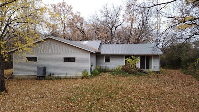 back of house featuring cooling unit