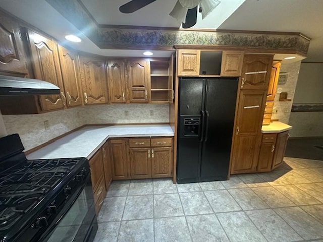 kitchen with exhaust hood, ornamental molding, black appliances, light tile patterned floors, and ceiling fan