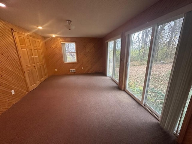 unfurnished sunroom featuring a healthy amount of sunlight