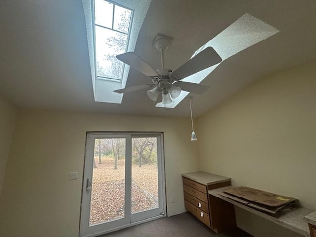 room details with carpet, a skylight, and ceiling fan