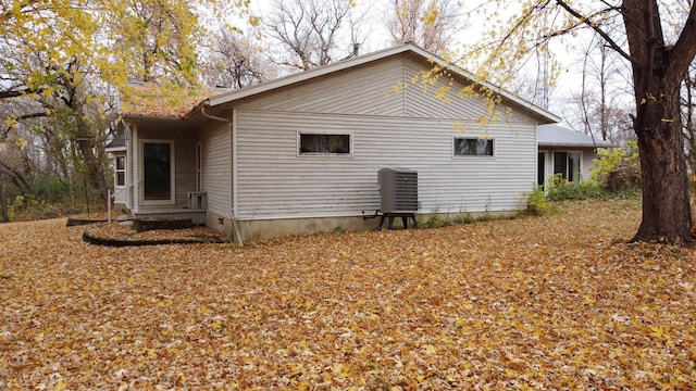 view of side of property featuring central AC unit