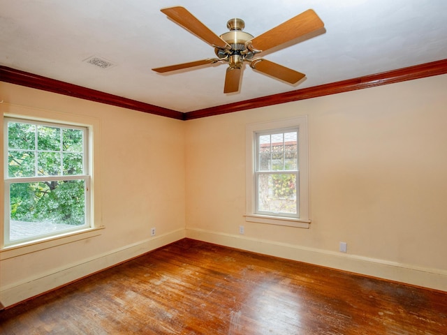 unfurnished room featuring ornamental molding, hardwood / wood-style flooring, plenty of natural light, and ceiling fan