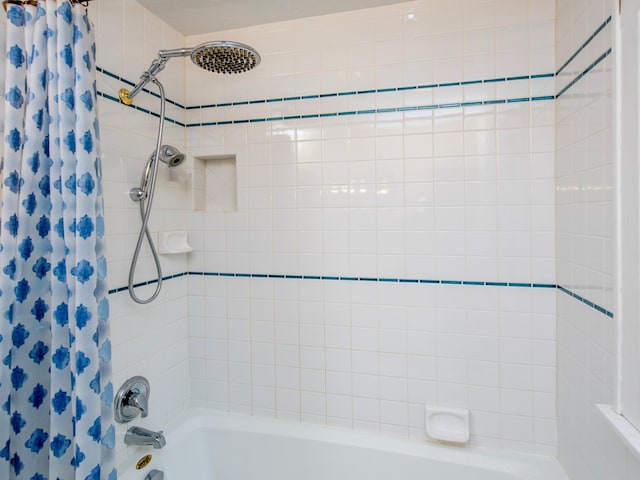 bathroom featuring shower / bathtub combination with curtain