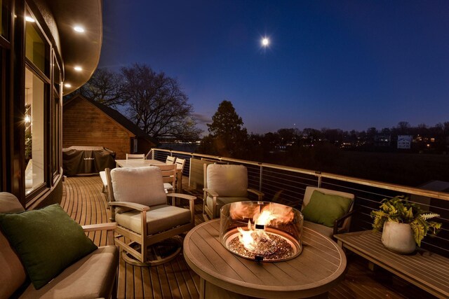 4637 Carlow Rd, Mound, MN 55364 - deck at twilight with an outdoor fire pit and grilling area