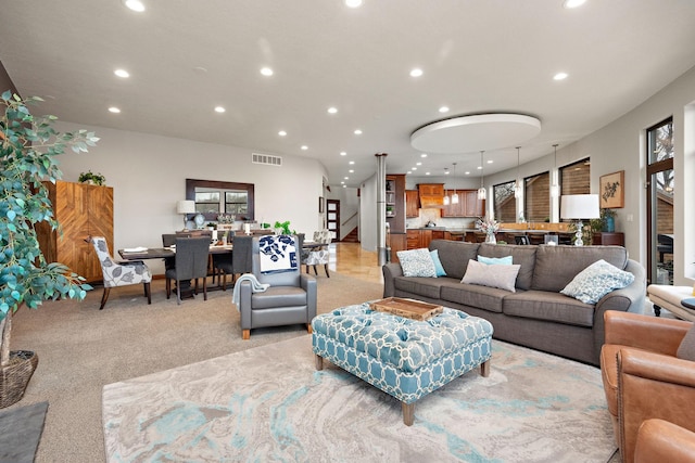 4637 Carlow Rd, Mound, MN 55364 - living area with recessed lighting, stairway, healthy amount of natural light, and light colored carpet