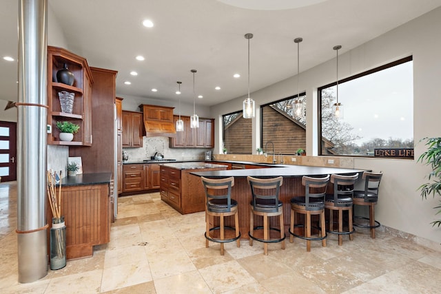 4637 Carlow Rd, Mound, MN 55364 - kitchen featuring a sink, stainless steel gas cooktop, recessed lighting, open shelves, and brown cabinetry