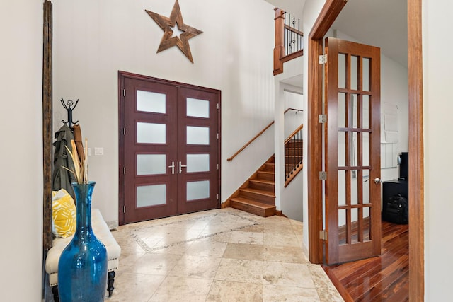 4637 Carlow Rd, Mound, MN 55364 - foyer featuring french doors, stairway, and a high ceiling