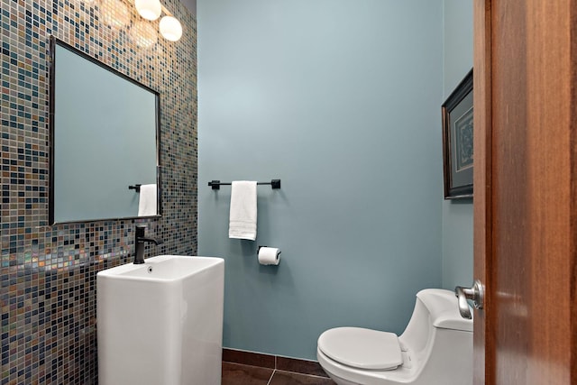 4637 Carlow Rd, Mound, MN 55364 - half bath with tile walls, toilet, tile patterned flooring, and baseboards