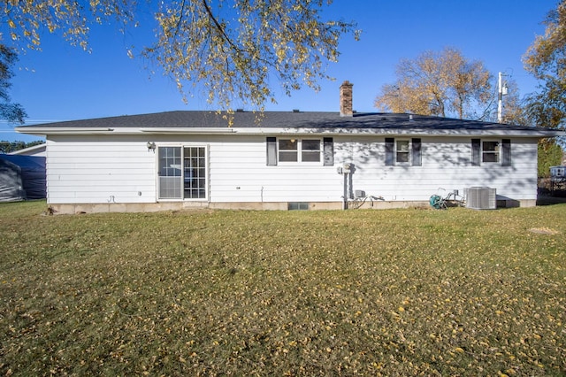 back of house featuring a yard and cooling unit