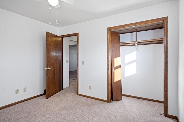 unfurnished bedroom with a closet, ceiling fan, and light colored carpet