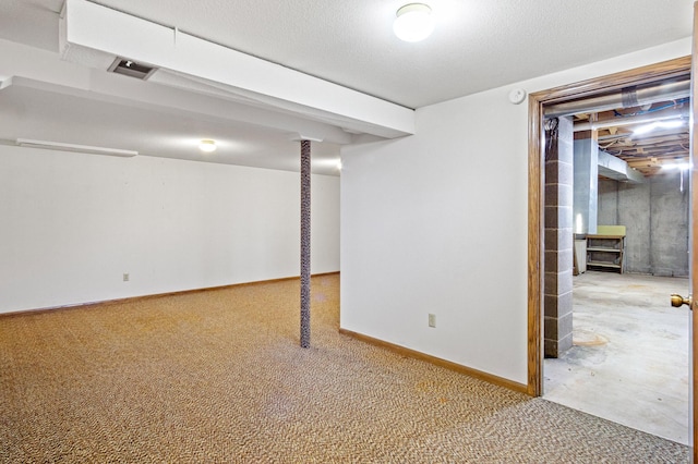 basement featuring a textured ceiling