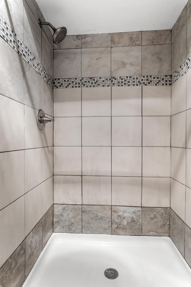 bathroom with tiled shower