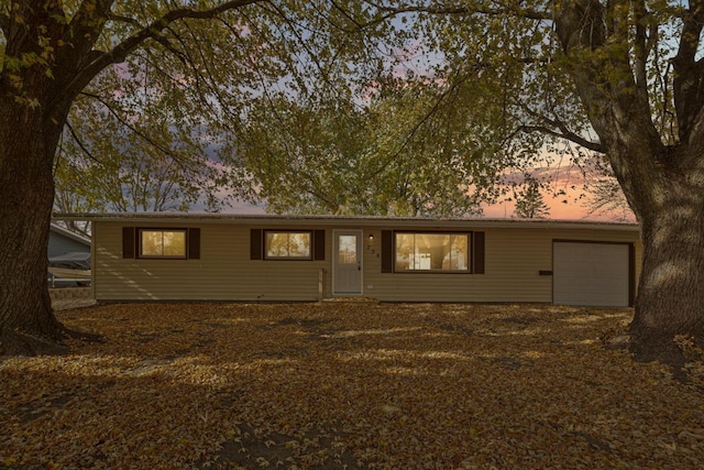 single story home featuring a garage