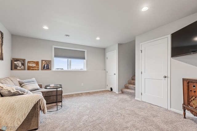 living area with light carpet