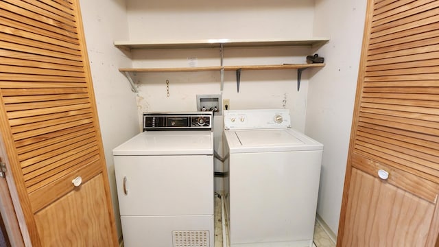 washroom featuring independent washer and dryer and laundry area