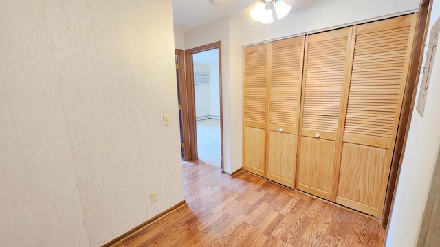 corridor featuring light wood-style flooring