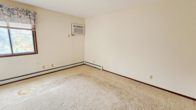 empty room featuring a baseboard radiator, an AC wall unit, baseboards, and light carpet