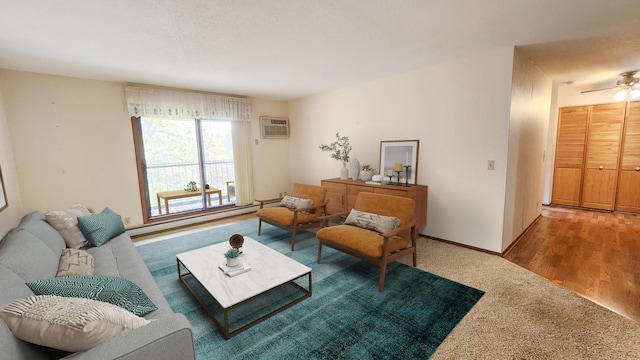 living room featuring a wall mounted air conditioner, carpet floors, baseboard heating, and ceiling fan