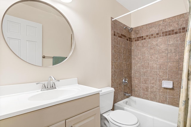 bathroom with vanity, toilet, and shower / bath combo with shower curtain