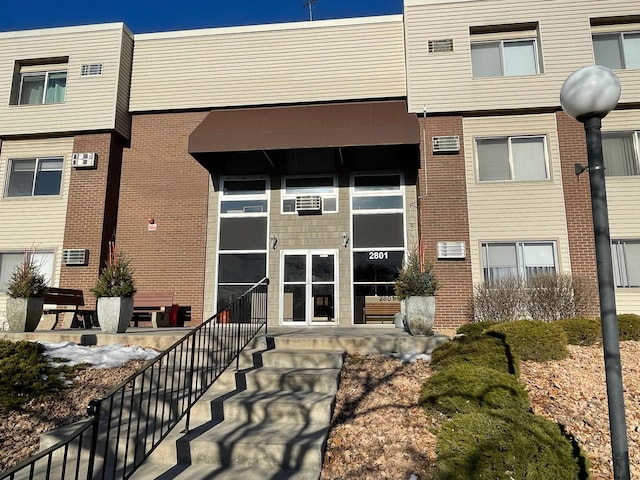 exterior space with brick siding