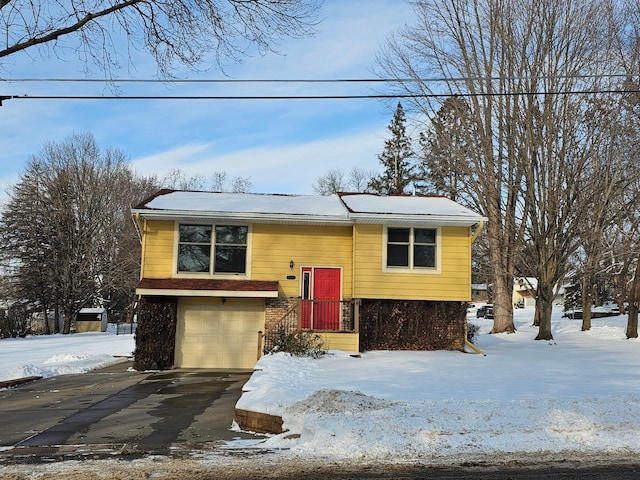 raised ranch featuring a garage