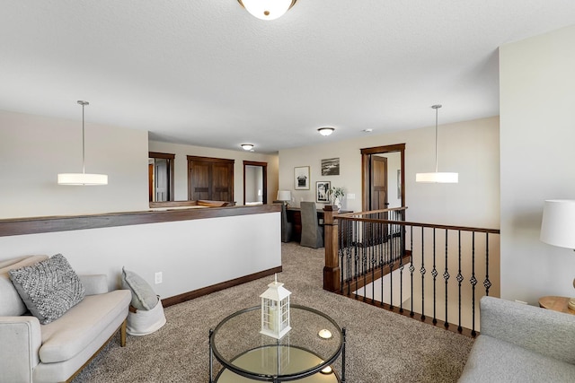 interior space featuring a textured ceiling and carpet floors