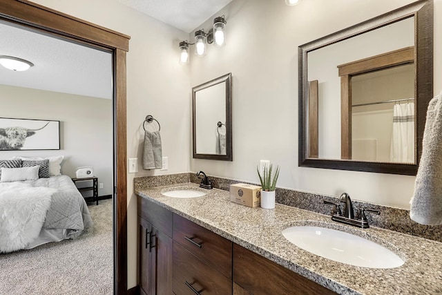 bathroom featuring vanity and a textured ceiling