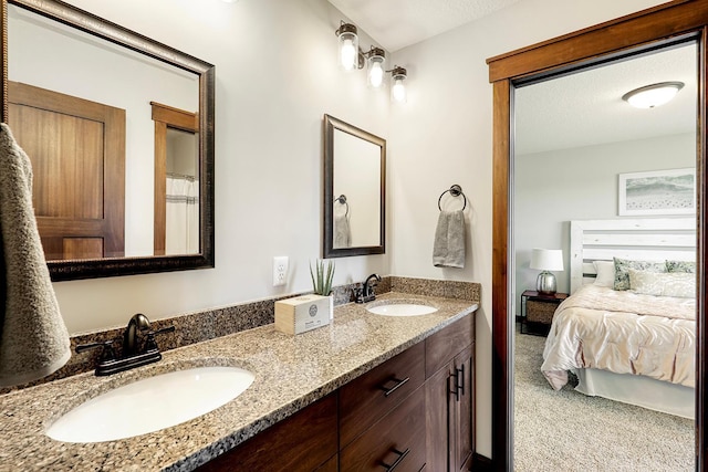 bathroom with vanity and a textured ceiling