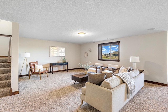 carpeted living room featuring a wealth of natural light and a textured ceiling