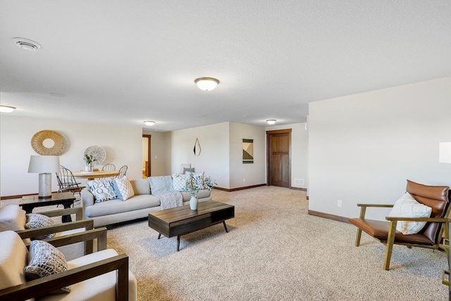 carpeted living room with a textured ceiling