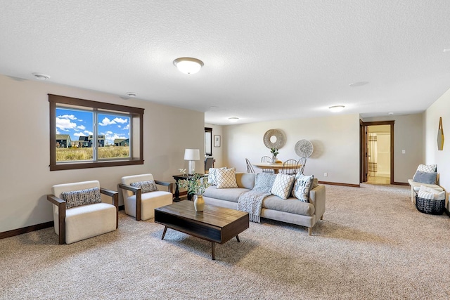 carpeted living room with a textured ceiling