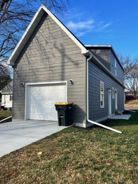 view of side of property with a yard