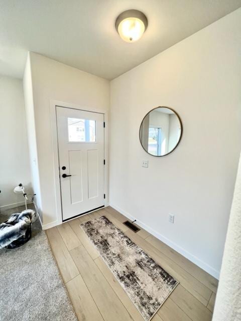 516 Elm St, Redwood Falls, MN 56283 - foyer entrance featuring light wood-style flooring and baseboards