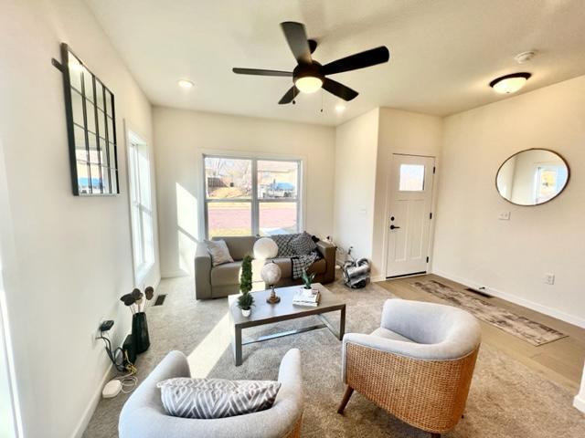 516 Elm St, Redwood Falls, MN 56283 - living room with a ceiling fan, baseboards, wood finished floors, and recessed lighting