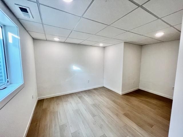 516 Elm St, Redwood Falls, MN 56283 - spare room featuring wood finished floors, baseboards, recessed lighting, and a paneled ceiling